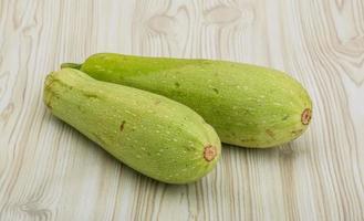 zucchini on wooden background photo