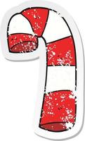 retro distressed sticker of a cartoon candy cane vector