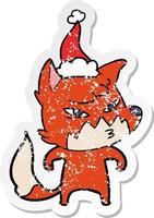 clever distressed sticker cartoon of a fox wearing santa hat vector