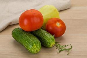 Fresh vegetables on wooden background photo