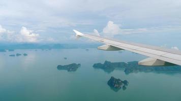 Aerial view over group of island in Andaman sea near Phuket, southern part of Thailand, view from descending airplane video