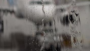 Storm at the airport. View of the airplane through rain drops and streams. Themes of weather and delay or canceled flight. video