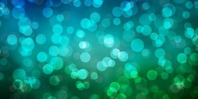 Light Blue, Green vector background with spots.