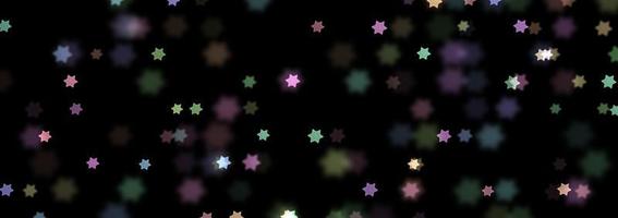 imagen de bokeh en forma de estrella con fondo negro. foto