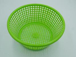 Green basket for various items. photo