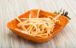 Dry calamari in a bowl on wooden background photo