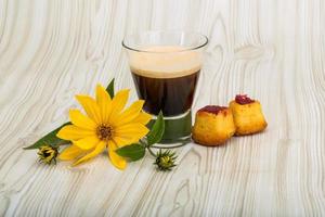 Espresso on wooden background photo