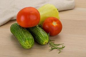 Fresh vegetables on wooden background photo