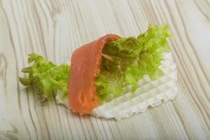 Wafer with salmon on wooden background photo