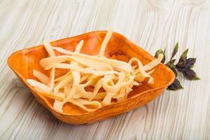 Dry calamari in a bowl on wooden background photo