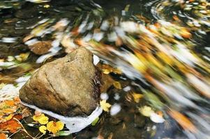 Stone in water photo