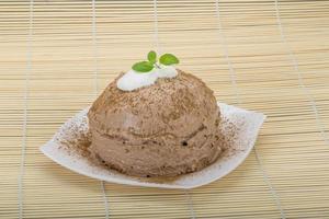 Homemade cake on the plate and wooden background photo