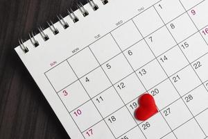 Red heart shape on the date of the 19th day in the calendar. photo