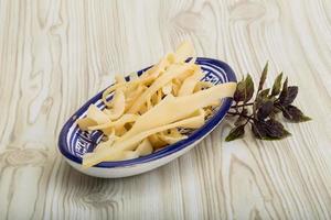 Dry calamari in a bowl on wooden background photo