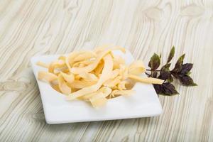 Dry calamari in a bowl on wooden background photo