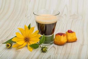 Espresso on wooden background photo