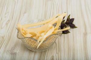 Dry calamari in a bowl on wooden background photo