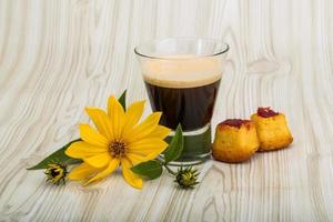 Espresso on wooden background photo