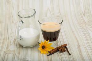 Espresso on wooden background photo