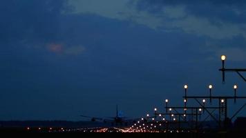 Widebody four engine jet airplane landing on runway 18R at early morning. Airport of Amsterdam, Holland video