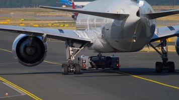 FRANKFURT AM MAIN, GERMANY JULY 21, 2017 - Cathay Pacific Boeing 777 B KPQ towing to service. Fraport, Frankfurt, Germany video