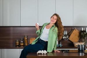 Young woman is preparing food in the kitchen. Prepare Food. photo