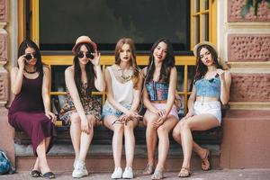 Five beautiful young girls relaxing photo