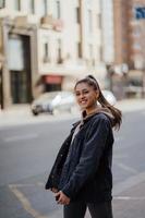 Portrait the young beautiful girl on the background of spring street photo