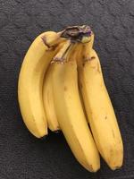 a bunch of bananas on a dark background photo