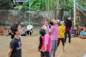 Magetan, Indonesia. August 17, 2022. Indonesian children are happy to celebrate Indonesia's independence day by participating in a competition. photo