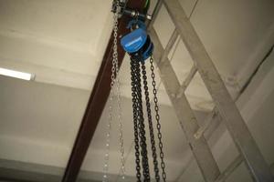 Chain on ceiling. Chains hang on steel beam. photo