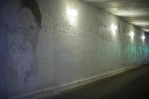 Wall is in tonal. Gray wall in underpass. Details of building. photo