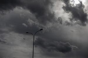 Light pole against sky. Celestial landscape in cloudy weather. photo