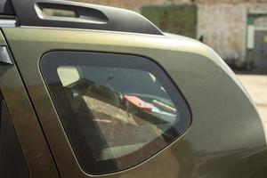 Rear side window of car. Small window in transport. Machine parts. photo