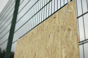 Fence on street. Just fence. Details of suburbs on territory. photo