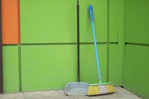 Broom and garbage can. Cleaning products. photo