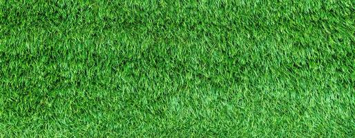 Panorama of green artificial turf flooring texture and background seamless photo