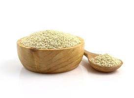 Close up bowl of white sesame on white background photo