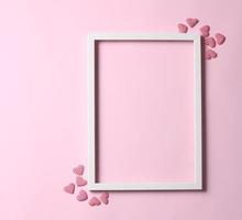 Valentine's day background - frame on pastel pink background photo