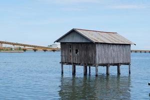 Pangkajene dan Kepulauan, South Sulawesi, Indonesia - April 16, 2022, Scenery of beautiful view of a house above the sea photo