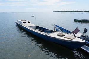 Pangkajene and Kepulauan, South Sulawesi, Indonesia - May 14, 2022, Empty boat is in the middle of the sea photo