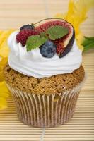 Cupcakes with berries photo