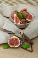 Ice cream with fig on wooden background photo