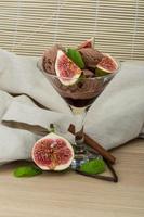 Ice cream with fig on wooden background photo