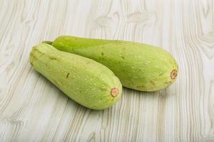 zucchini on wooden background photo