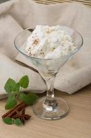 Ricotta cheese on wooden background photo