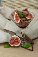 Ice cream with fig on wooden background photo