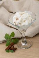 Ricotta cheese on wooden background photo