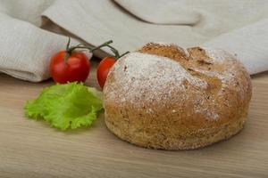 Bread on wooden background photo