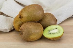 Kiwi fruit on wooden background photo